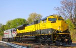 Two of the newsest repainted units make a move to the service track in the afternoon sun 